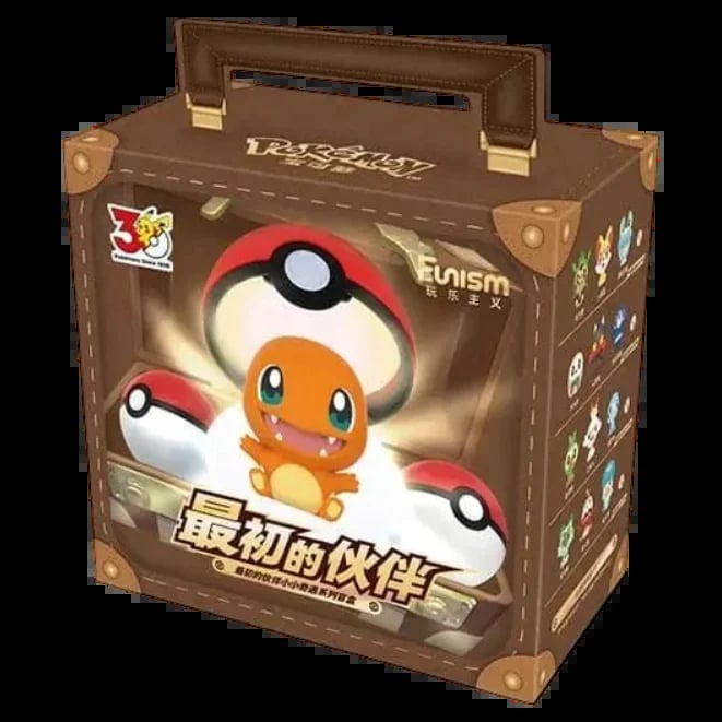 Pokemon Evism collectible box featuring Charmander character with red and white pokeballs on brown suitcase-style packaging
